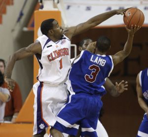 Clemson's K.C. Rivers blocks a shot attempt by Presbyterian College's Ryan Lamb during the first half.