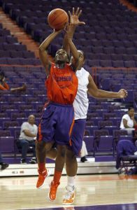 Chelsea Lindsay knocks in a layup by Deja Hawkins at the Orange and White scrimmage.