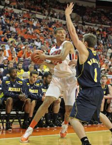 Clemson's Milton Jennings, left, gets trapped in the corner by Michigan's Stu Douglass in the first half of their NCAA basketball game at Littlejohn Coliseum in Clemson, S.C. on Tuesday, Nov. 30, 2010. (AP Photo/Anderson Independent-Mail, Mark Crammer)