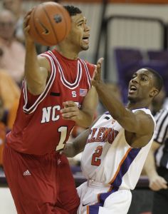 Demontez Stitt puts pressure on North Carolina State's Marques Johnson as he tries to pass the ball during the first half of the baketball game in Clemson, S.C., Saturday, Jan. 15, 2008. (AP Photo/Patrick Collard)
