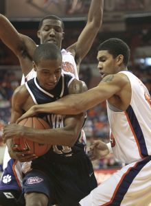Clemson's David Potter, right, and teammate Sam Perry, top, put pressure on Samford's Trey Montgomery during the second half of the basketball game in Clemson, S.C., Saturday, Dec. 29, 2007. Clemson won, 78-45. (AP Photo/Patrick Collard)