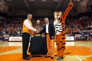 tommy bowden with trophy at halftime