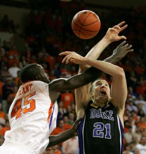 Duke's Miles Plumlee(21) drives for the basket as Clemson's Jerai Grant (45) blocks his shot during the first half of an NCAA college basketball game Saturday, Jan. 23,2010, at Littlejohn Coliseum in Clemson, S.C. (AP Photo/Mary Ann Chastain)