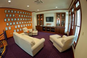 Wide angle photos of the interior rooms of the Penley Golf Facility. James C. Self Jr. Captains Room