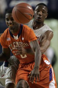 Liberty's Evan Gordon, rear,and Clemson guard Demontez Stitt (2) fight for the ball during the second half of their college basketball game at the Vines Center in Lynchburg, Va., Tuesday, Nov. 17, 2009. Clemson won the game 79-39. (AP Photo/Steve Helber)