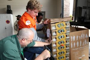 Members of the Clemson football team spent the morning of Monday, December 20 volunteering at Harvest Hope Food Bank in Greenville.