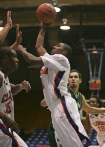 Clemson's Demontez Stitt, center, shoots against Mayaguez at the San Juan Shoot Out basketball tournament in Guaynabo, Puerto Rico, Thursday, Dec. 20, 2007. (AP Photo/Brennan Linsley)