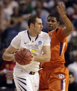 Clemson's Devin Booker (31) defends as West Virginia's Cam Thoroughman (2) attempts to pass during an East regional second round NCAA tournament college basketball game in Tampa, Fla., Thursday, March 17, 2011. (AP Photo/Chris O'Meara)