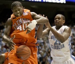 Clemson's James Mays (40) and North Carolina's Deon Thompson (21) battle for possession during the first half of a college basketball game in Chapel Hill, N.C., Sunday, Feb. 10, 2008. (AP Photo/Gerry Broome)