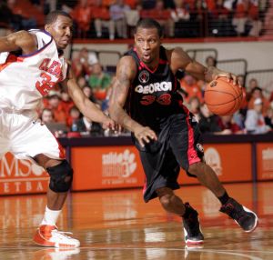 Georgia's Mike Mercer (33) attempts to drive by Clemson defender Sam Perry (32) during first half of college basketball action Thursday, Dec. 28, 2006, in Clemson, S.C. (AP Photo/Willis Glassgow)