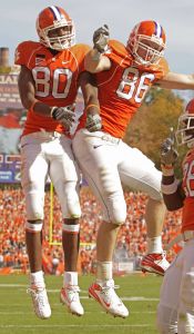 Aaron Kelly, (80), celebrates with Michael Palmer, (86) after Kelly made a touchdown catch against against Wake Forest. (AP Photo/Patrick Collard)