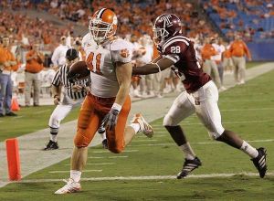 Clemson's Alex Pearson (41) is in for the touchdown as Temple's Evan Cooper Jr. (28) tries to catch him during the first half of their football game Thursday, Oct. 12, 2006, at the Bank of America Stadium in Charlotte, N.C. (AP Photo/Mary Ann Chastain)