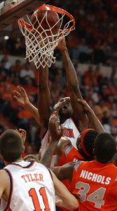 Raymond Sykes is fouled as he dunks during the first half of a quarterfinal NIT tournament game against Syracuse Wednesday. (AP Photo/Sefton Ipock)