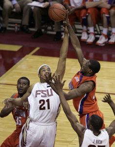 Clemson's Trevor Booker gets a shot off against Florida State's Julian Vaughn in the second half of a basketball game which the Seminoles won 64-55 on Tuesday, Feb. 19, 2008, in Tallahassee, Fla. (AP Photo/Steve Cannon)