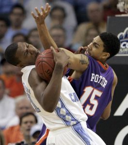 North Carolina's Deon Thompson battles David Potter for the ball. (AP Photo/Steve Helber)