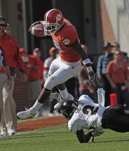 C.J. Spiller jumps through the arms of Wake Forest's Alphonso Smith during the first half. (AP Photo/ Patrick Collard)