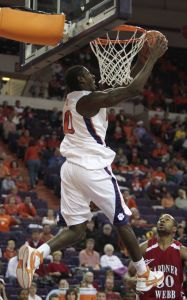 James Mays goes up for a reverse dunk as Gardner-Webb's Lu Dovonou looks on during the first half. (AP Photo/ Patrick Collard)