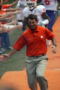 Dabo Swinney running down the hill