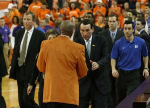 Oliver Purnell and coach K handshake