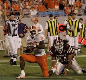 Clemson's C.J. Spiller(28) is in for the touchdown as Temple's Philip Simpson (94) couldn't stop him during the first half of their football game Thursday, Oct. 12, 2006, at the Bank of America Stadium in Charlotte, N.C. (AP Photo/Mary Ann Chastain)