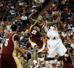 Clemson's Donte Hill (32) maintains ball control to score while being pressured by Winthrop's Robbie Dreher (22) and Matt Morgan (5) during the second half of an NCAA college basketball game Monday, Nov. 23, 2009, at Littlejohn Coliseum in Clemson, S.C. Clemson defeated Winthrop 102-66. (AP Photo/Richard Shiro)