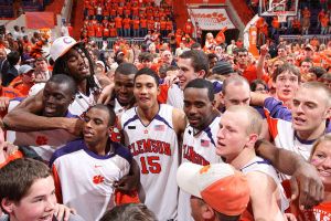 team celebrate on court postgame