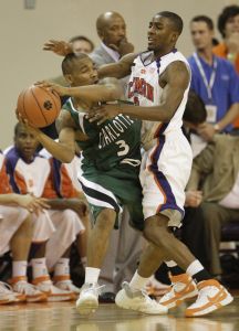 Clemson's Demontez Stitt puts pressure on Charlotte's DiJuan Harris as he tries to pass the ball during the first half.