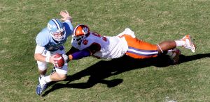Clemson defensive end Da'Quan Bowers (93) bring down North Carolina quarterback T.J. Yates (13). (AP Photo/Jim R. Bounds