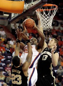 Trevor Booker shoots against Wake Forest's James Johnson, left, and Chas McFarland during the first half of the baketball game in Clemson, S.C., Tuesday, Jan. 22, 2007. (AP Photo/Patrick Collard)