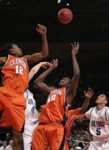 Clemson's Raymond Sykes (12) and James Mays (40) fight for a rebound with Air Force's Nick Welch, second from left, and Matt McCraw (5) during the first half of basketball game Tuesday, March 27, 2007 during the National Invitation Tournament at Madison Square Garden in New York. (AP Photo/Seth Wenig)