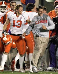 Clemson interim head coach Dabo Swinney, right, and Tyler Grishami (13) celebrate the team's 27-21 win against Boston College.