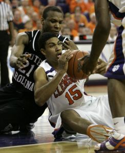 Clemson's David Potter passes of the ball as South Carolina's Dominique Archie tries to grab it during the second half.