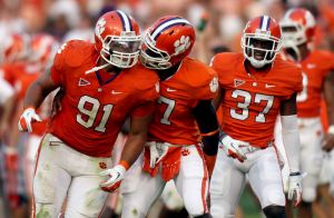 Josh Watson celebrates with his teammates after blocking a field goal in the fourth quarter.