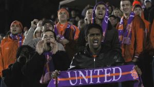 Fans celebrate the Tigers' win in penalty kicks.