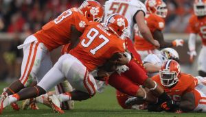 Corey Crawford, Malliciah Goodman and DeShawn Williams