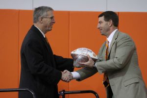Head Coach Dabo Swinney presented a football to former Athletic Director Terry Don Phillips commemorating the completion of the facility and the Tigers? Chick-fil-A Bowl win over LSU.