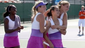 Beatrice Gumulya surrounded by teammates after her win.