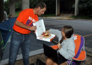 The IPTAY Collegiate Club members are waiting in line for tickets to the Clemson-Georgia football game, which will be distributed beginning Monday morning.