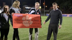 Head Coach Mike Noonan and members of the Clemson women?s soccer team presented a check to Red Card Cancer for donations raised by the men?s and women?s teams during the 2013 season.