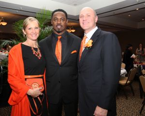 Clemson President James P. Clements and his wife, Beth, with Brian Dawkins