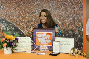 Senior Vanessa Laxgang poses with her collection of awards.