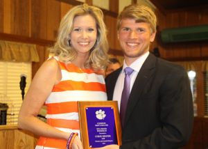 Academic Advisor Lindsey Ricketts presents the Freshman GPA Award to Chris Heijjer