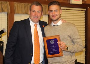 Head Coach Mike Noonan presents the Dalton Family Most Valuable Player Award to Paul Clowes