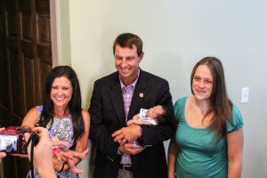 Dabo and Kathleen Swinney with transitional house residents.